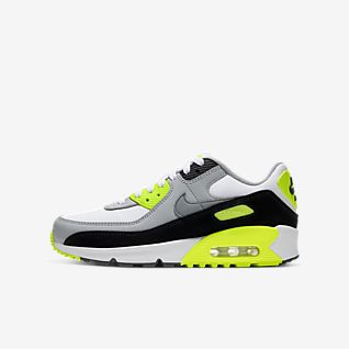 grey and neon green nike shoes