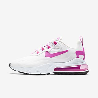 white nike trainers with pink tick