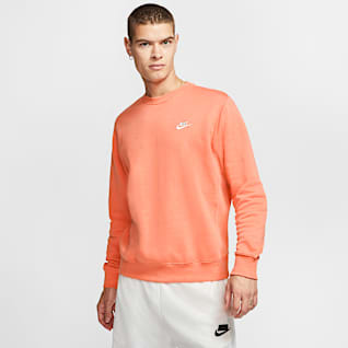 white nike shirt with orange swoosh