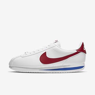 white and navy blue nike cortez