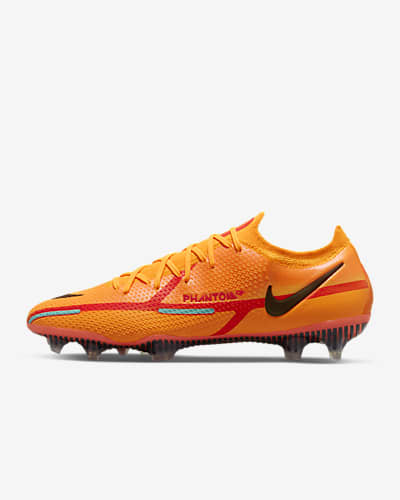 Usando una computadora clérigo Mala fe Hombre Naranja Fútbol Calzado. Nike US