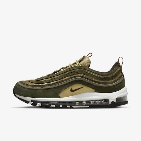 green and white nike trainers