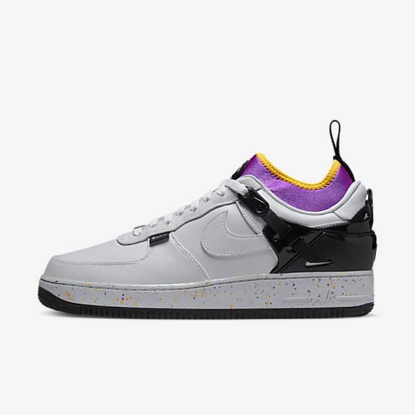 Professor hand in Calm Grey Air Force 1 Shoes. Nike.com