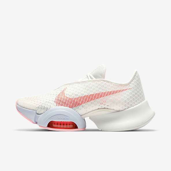 womens white nike shoes with pink swoosh