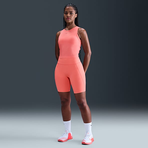 Nike Universa Shorts de ciclismo con bolsillos de 20 cm de tiro alto y media sujeción para mujer
