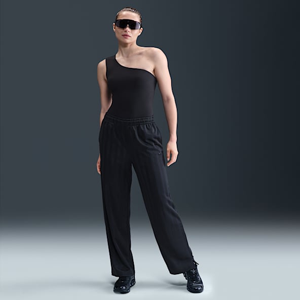 Nike Sportswear Pants deportivos de jacquard a rayas de tiro medio holgados para mujer