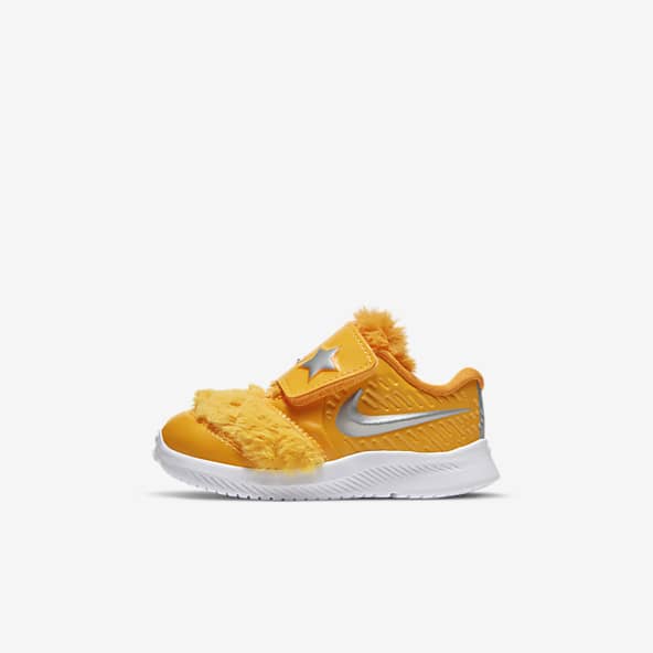 Baby blue and orange nike shoes