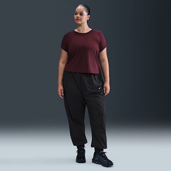 Nike Sportswear Classic Wovens Joggers de tiro medio holgados con protección contra los rayos UV para mujer (Talla grande)