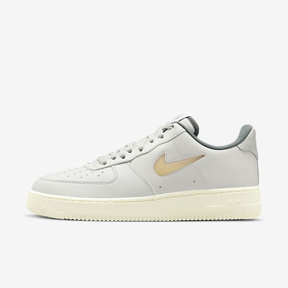 Professor hand in Calm Grey Air Force 1 Shoes. Nike.com