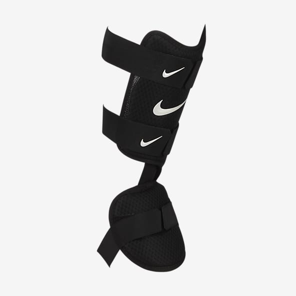 Correspondiente a Brote Antecedente Espinilleras. Nike US