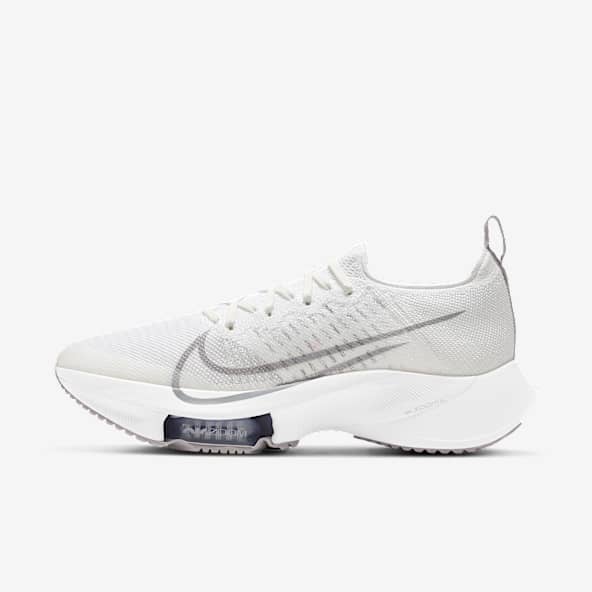 white nike laceless shoes
