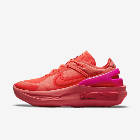 red and pink nike trainers