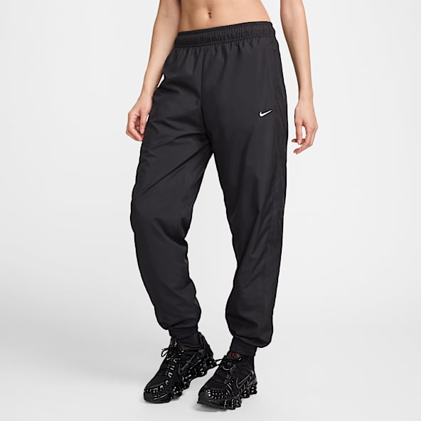 Nike Sportswear Classic Wovens Joggers de tiro medio holgados con protección contra los rayos UV para mujer