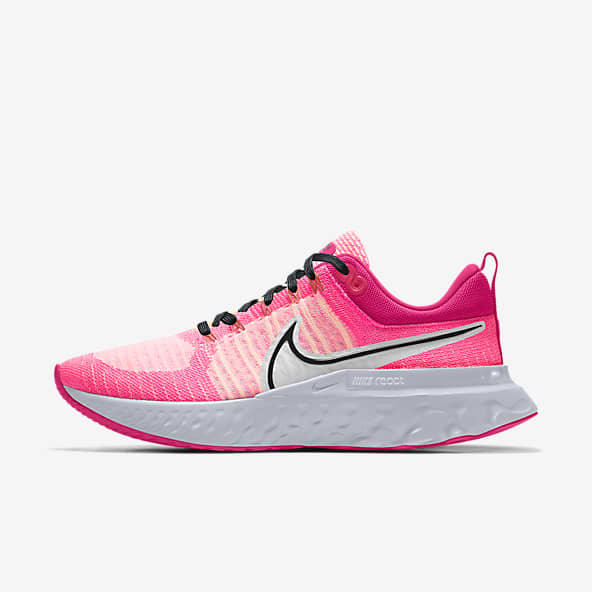 pink white nike shoes
