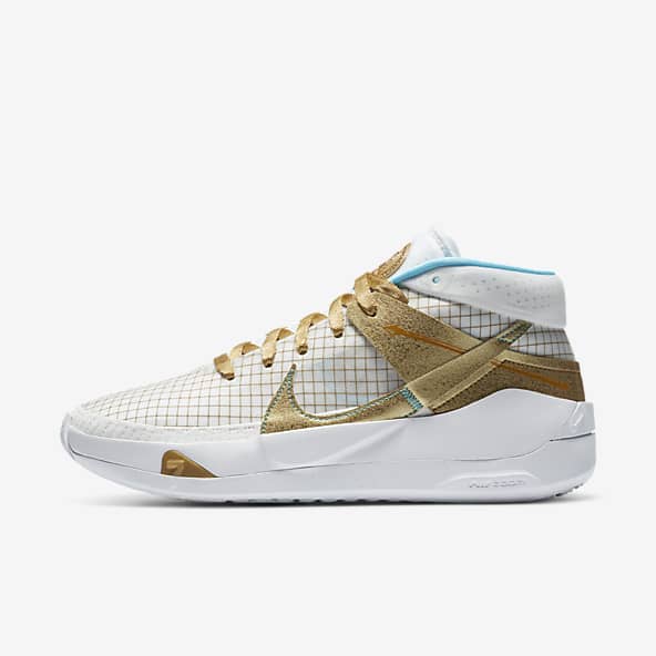 white nike basketball shoes with gold swoosh