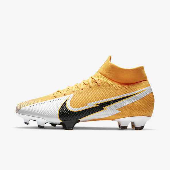 orange and white soccer cleats