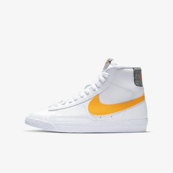 white and orange nike blazers