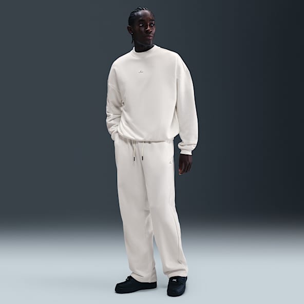 Nike Standard Issue Pants de básquetbol Therma-FIT cepillados con dobladillo abierto para hombre