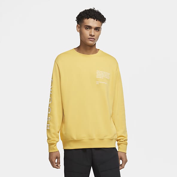 white nike shirt with yellow swoosh