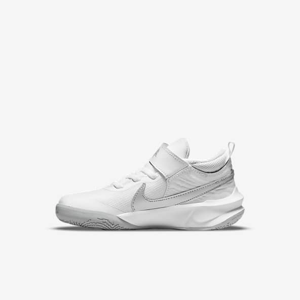 gold and white nike basketball shoes