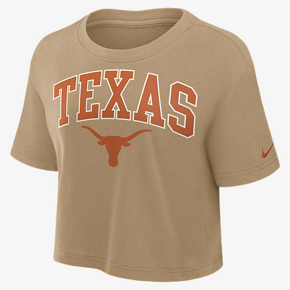 Texas Athletic Prep Arch Playera universitaria Nike Dri-FIT cropped para mujer