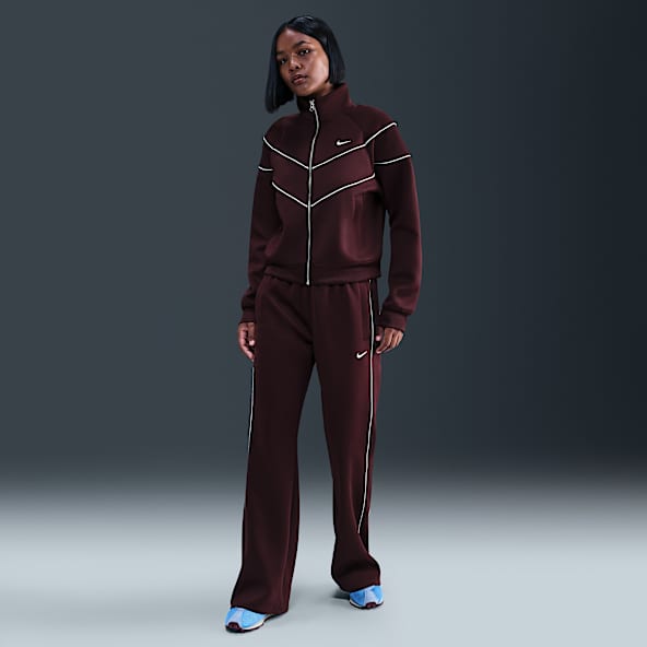 Nike Sportswear Windrunner Dámské pletené kalhoty se středně vysokým pasem a zeštíhleným střihem