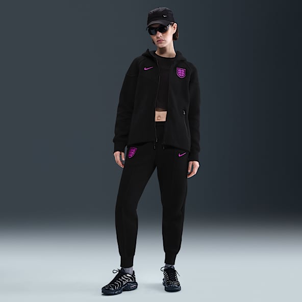 England Tech Nike Football-joggers i fleece med mellemhøj talje til kvinder