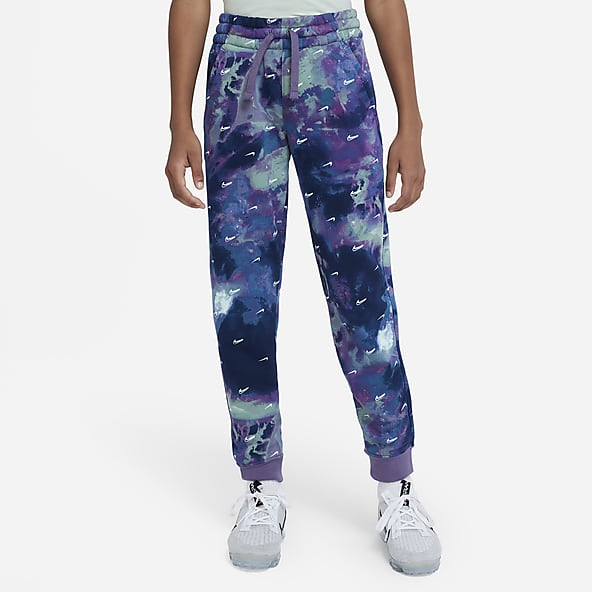 Nike sportswear all over print track pants clearance