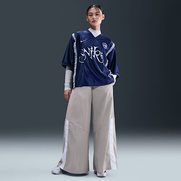 Nike Sportswear Pants de tejido Woven de pierna ancha para mujer