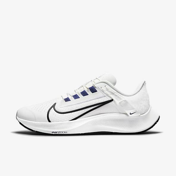 white nike shoes with black check