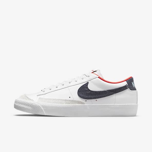 white and red nike shoes