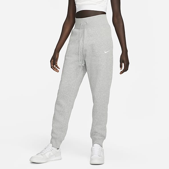 Nike mini Swoosh oversized joggers in grey - ShopStyle Pants