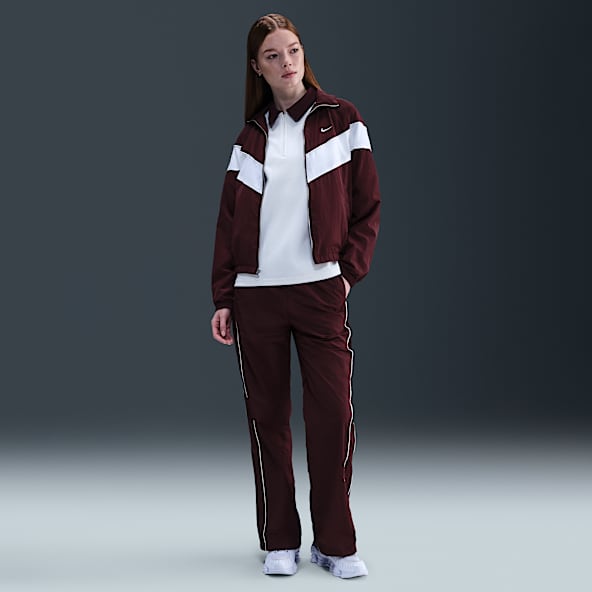 Nike Windrunner Vävda byxor med hög midja och vida fållar för kvinnor