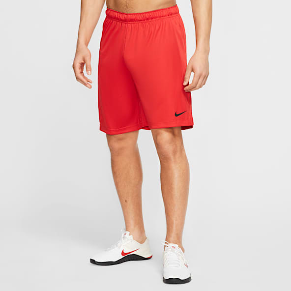 red nike football shorts