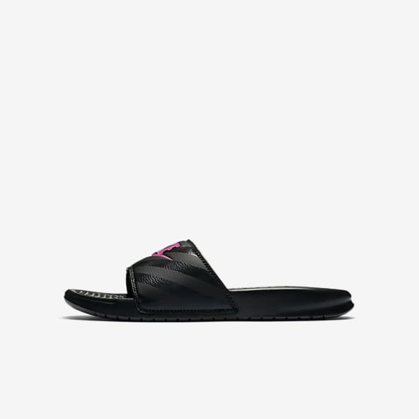 pink and black nike flip flops