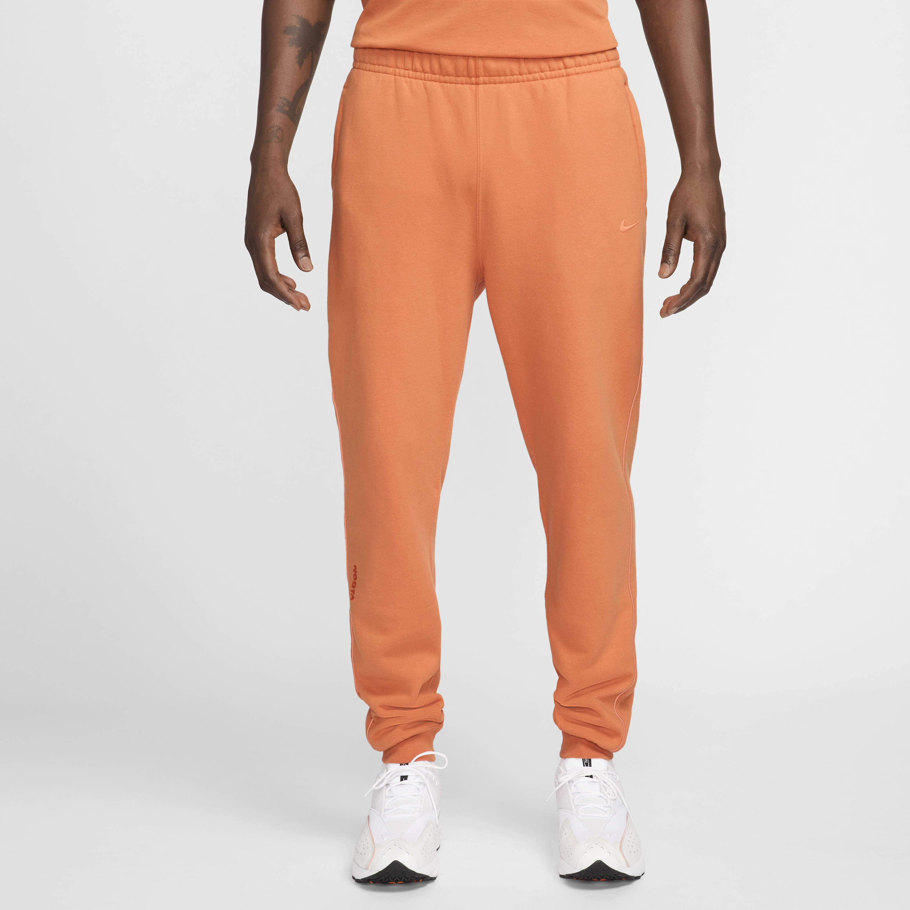 orange nike tracksuit bottoms