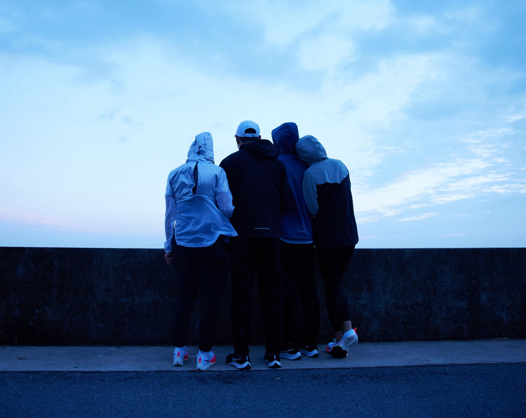 Behind some visually impaired runners are running pacers