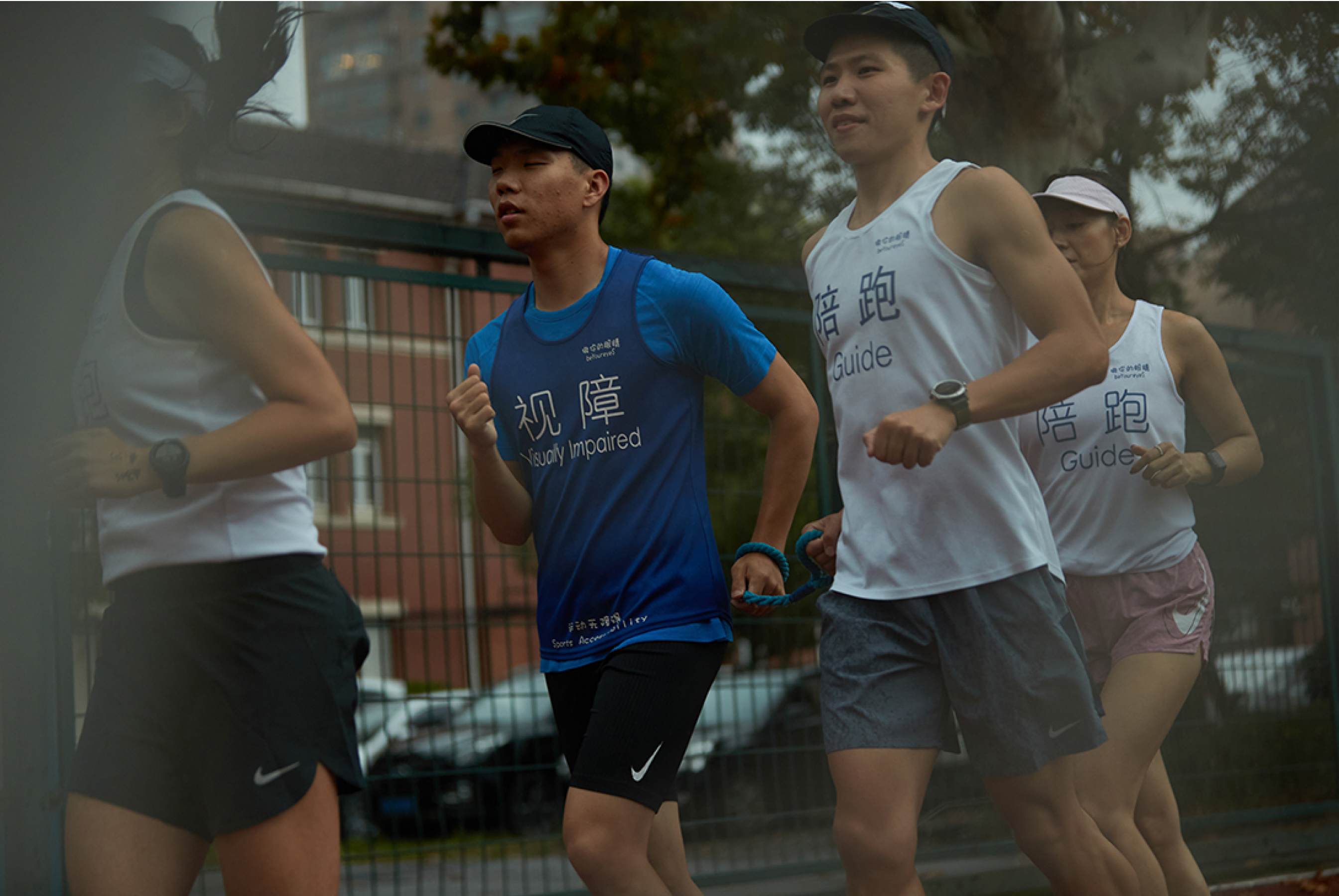 Behind some visually impaired runners are running pacers