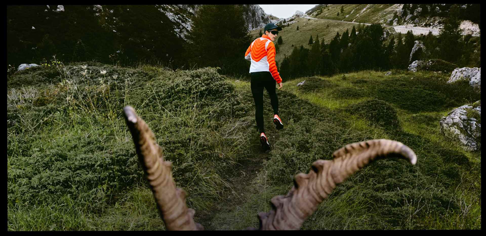 A hiker in full ACG gear stares up at their challenge.