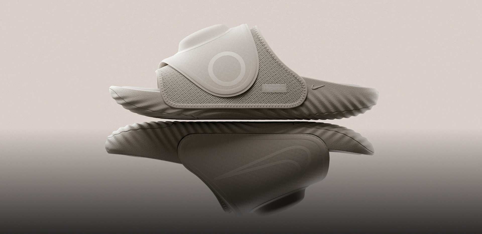 Black Nike slides with orange-to-red gradient interior and sculptural sole design against grey background, 신는 순간, 시작되는 회복