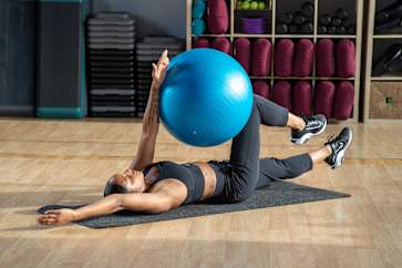 basketball player performing dead bug exercise