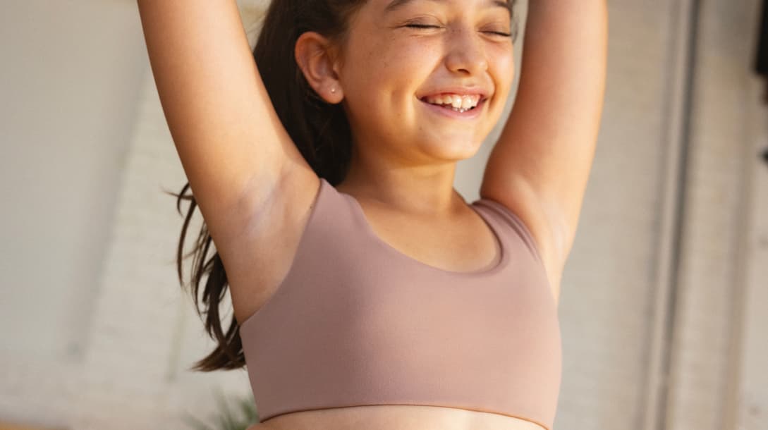 Young girls in sports bras on sale