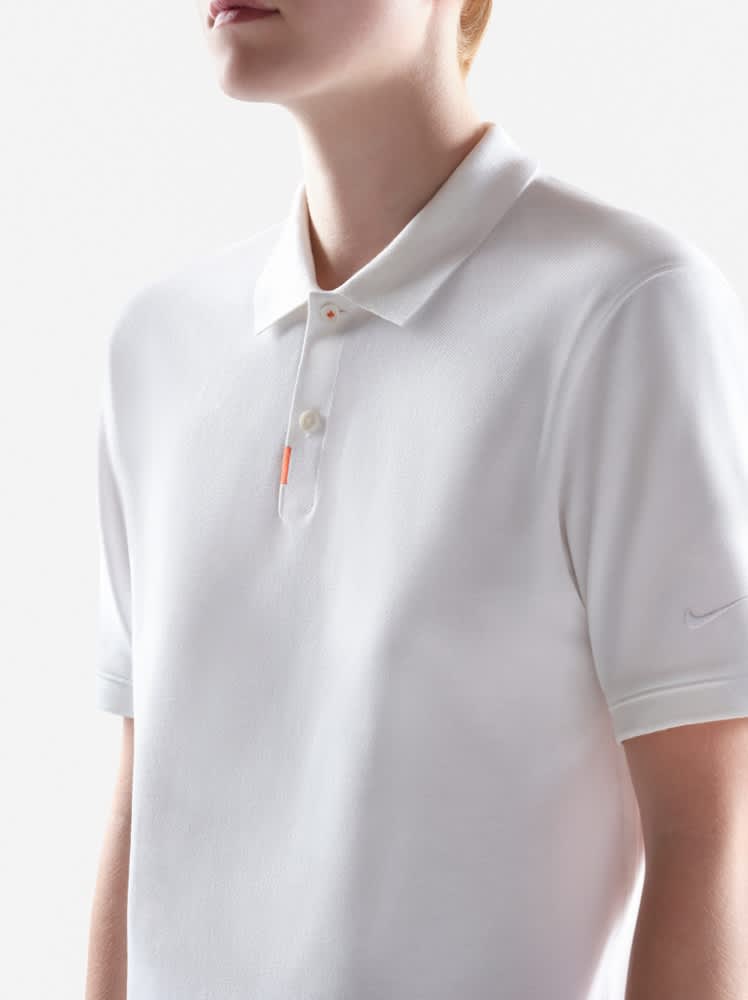 nike golf shirt with golf clubs on it