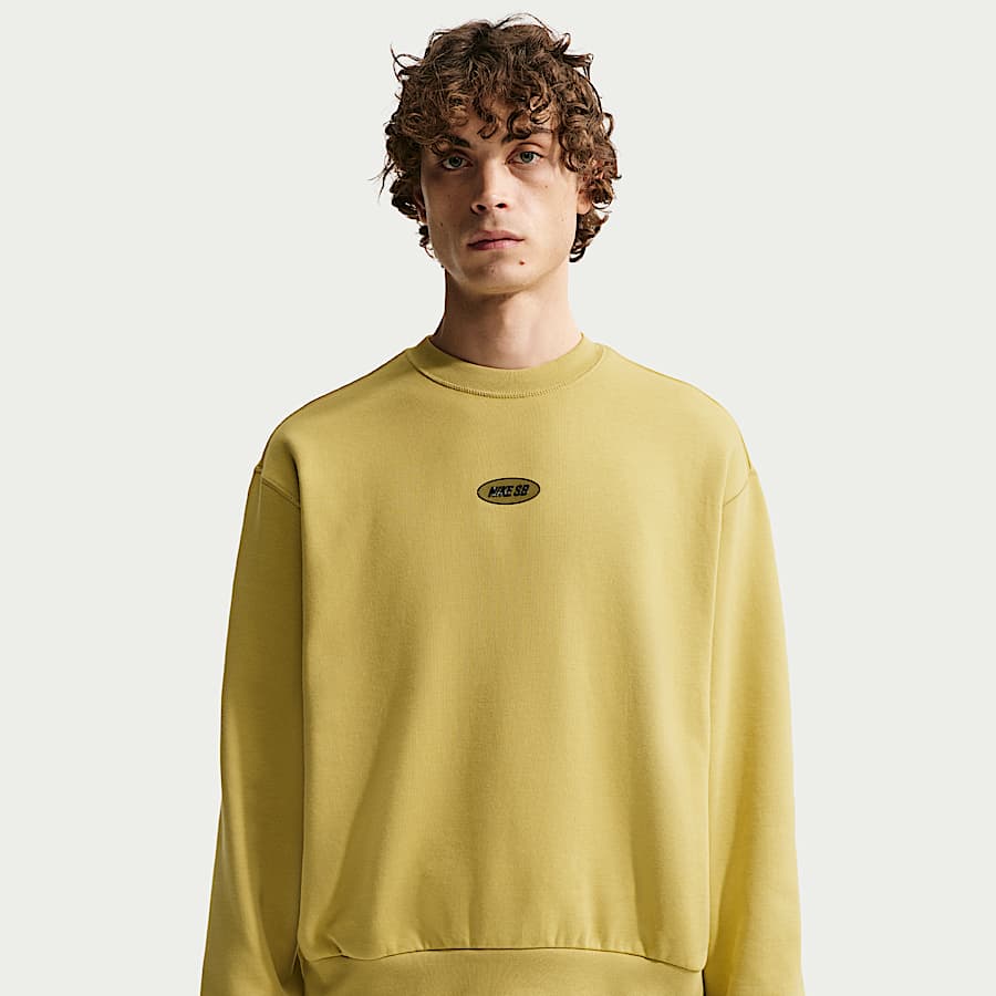 nike all over logo print cropped sweatshirt in camel