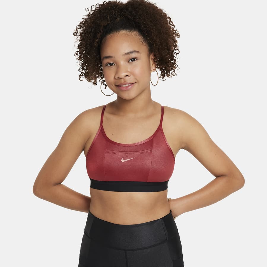 Free Photos - A Female Athlete Wearing A Red Sports Bra And Shorts,  Showcasing Her Fitness Attire And Sponsorship With Nike. She Is Standing  With Her Hand On Her Hip, Displaying Confidence
