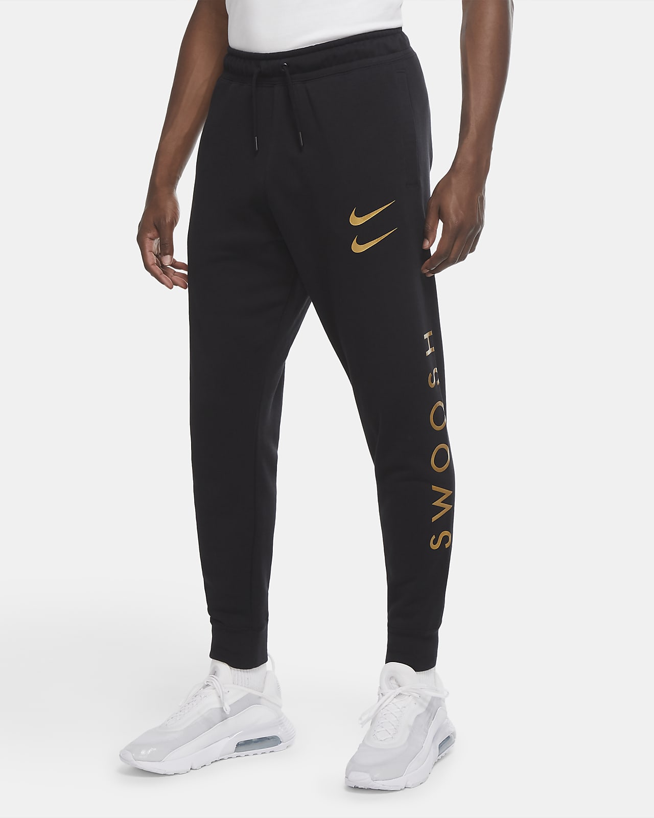 nike swoosh joggers in black and gold