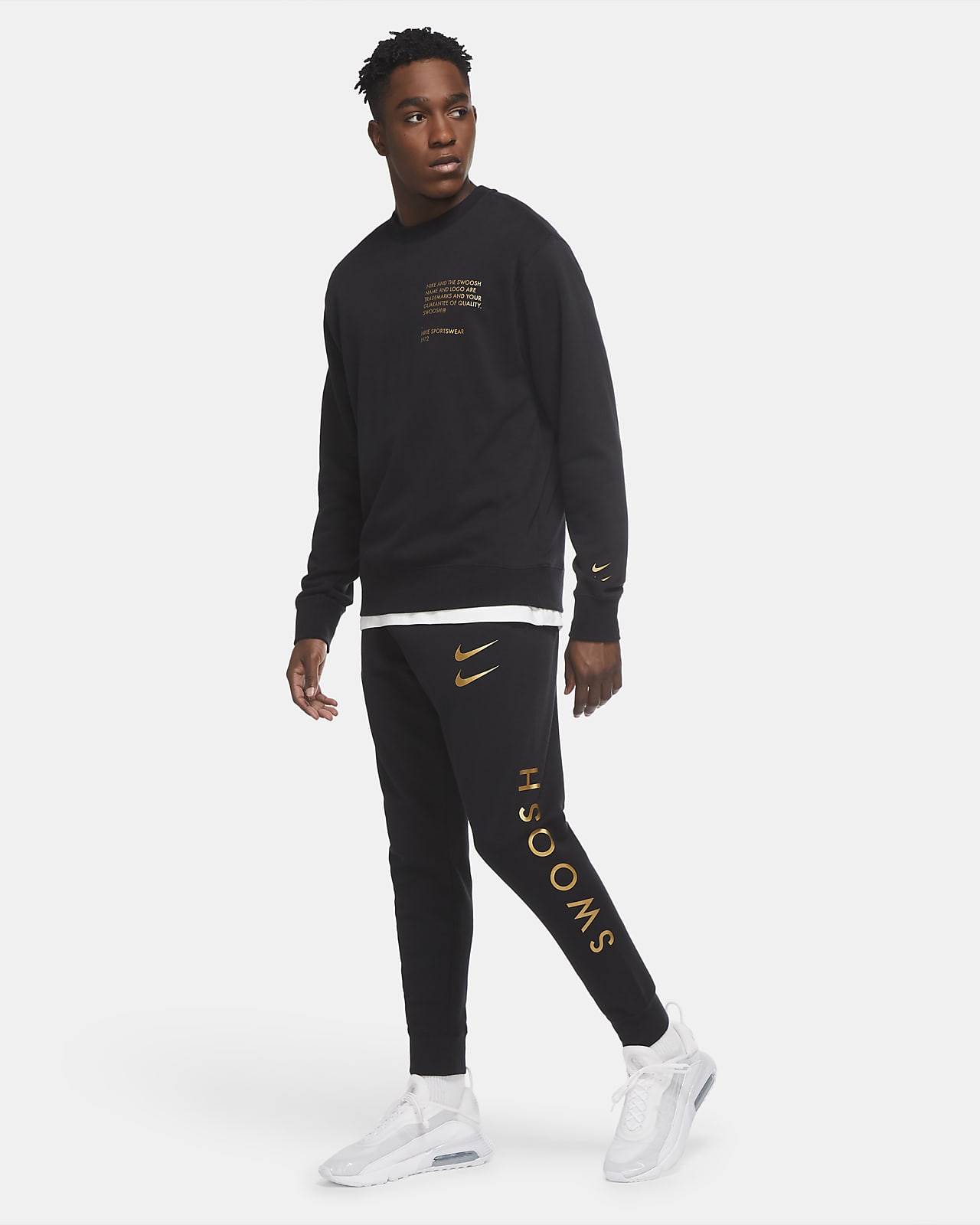 nike swoosh joggers in black and gold