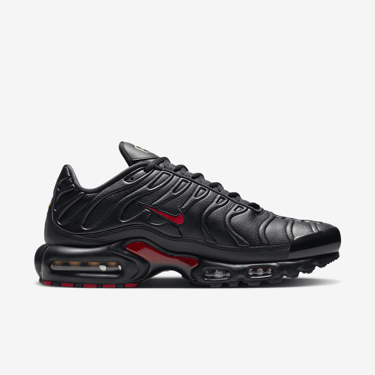 Nike Air Max Plus Premium sneaker Zwart/Zwart/Metallic Gold/University Red