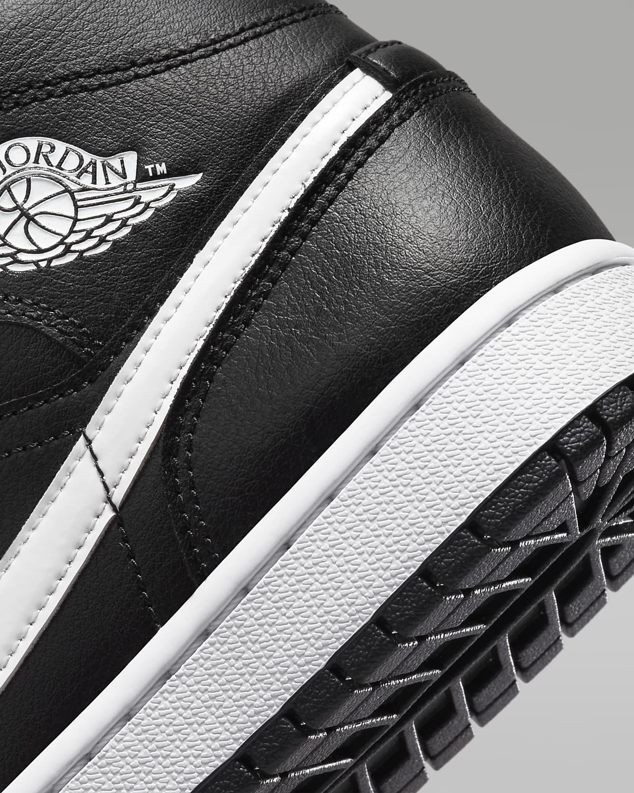 Nike Air Jordan 1 Mid sneakers in gray and white