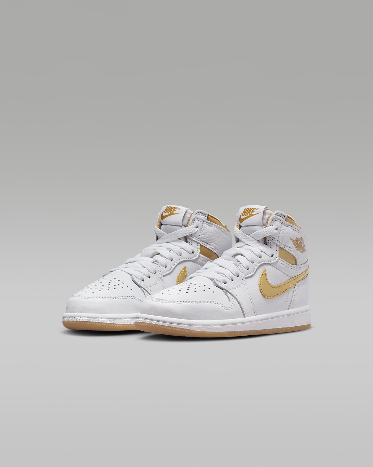 White and gold nike top high tops